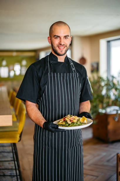 istock Chef Holding A Pasta Salad In A Restaurant Indoors 2174647818