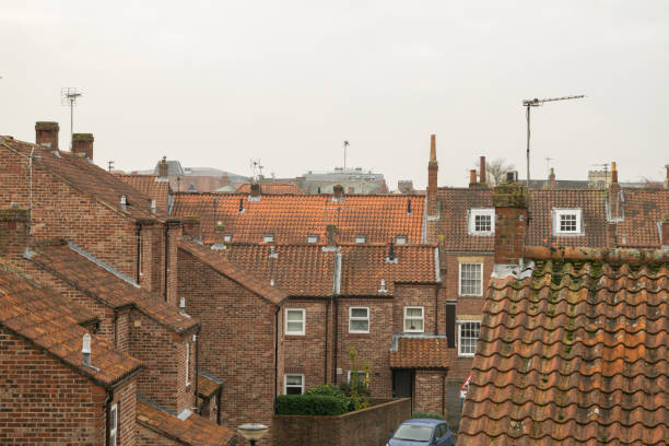 istock Rooftops of British brick houses in York England 2174648545