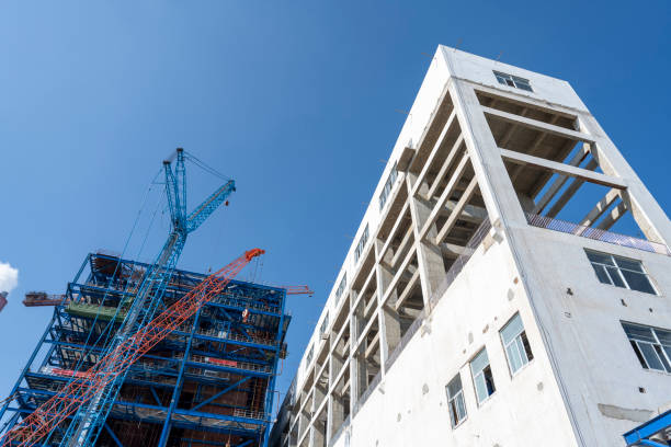 istock Low angle visual perception of chemical plant buildings under construction 2174649862