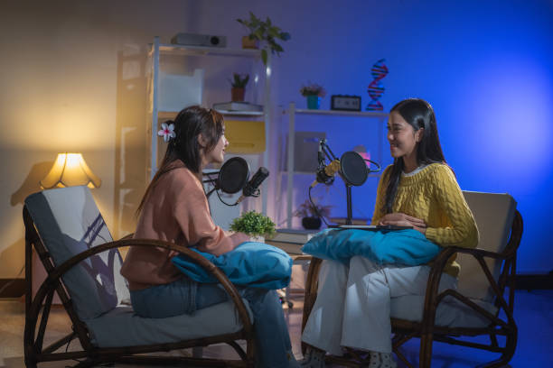 istock Two Asian women having a fun conversation during a podcast. 2174659164