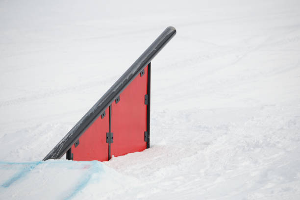 young snowboarder riding on jibbing handrail