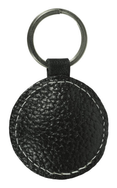 istock Quality black leather keychain pendant isolated on white background 2174665022