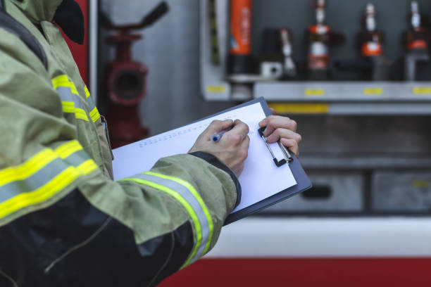 istock Firefighter checking fire equipment in a fire truck 2174665820