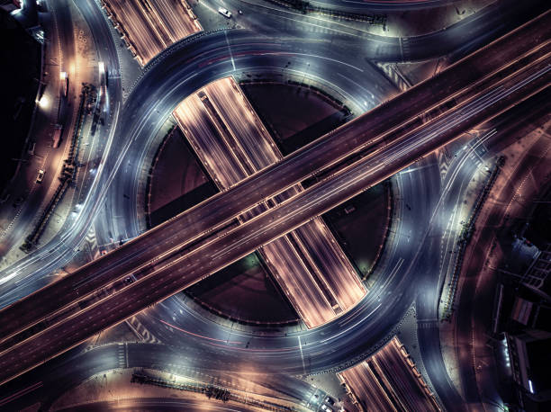 istock Expressway top view, Road traffic an important infrastructure, Drone aerial view fly in circle, traffic transportation, Public transport or commuter city life concept of economic and energ, transport. 2174666197