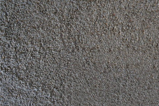 istock Structure of a single-colored concrete surface. Wall plaster in grey color 2174669203