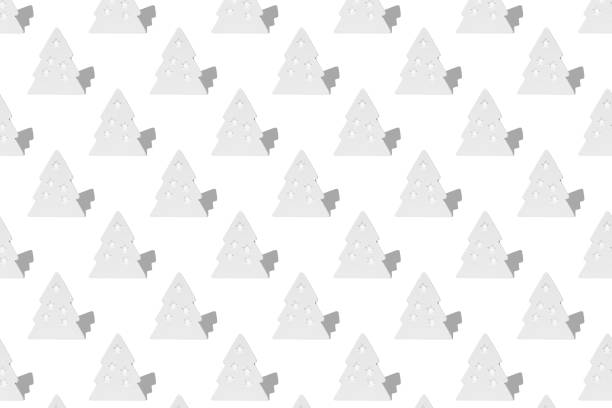 Horizontal seamless pattern of white Christmas tree decorations with shadow isolated on white background.