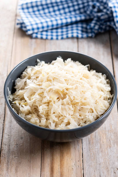 istock Sauerkraut in a bowl on wooden table 2174670922