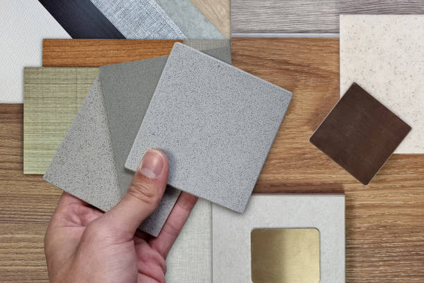 istock interior design material board in close up view for architecture or house decoration consists of wooden vinyl flooring tiles, stone tile, quartz, gold stainless, veneer, draperies, fabric laminated. 2174675754