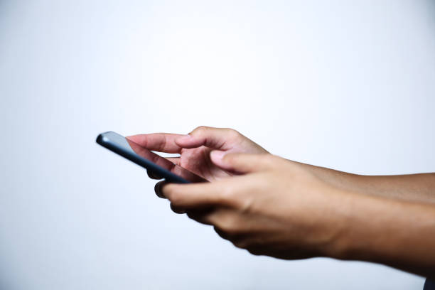 istock Hand holding smartphone on white background. QR code payment concept. Digital money payment. 2174677660