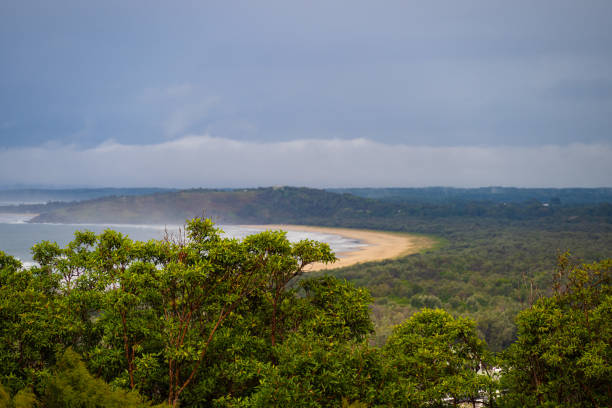 Aerial view overlooking One Mile Beach at the city of Forster, Australia. Seen dramatic cloudy day.