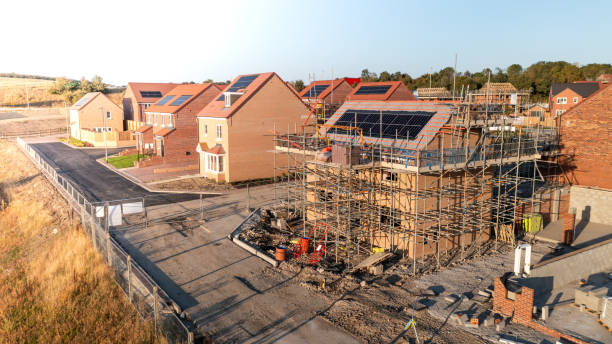 istock Aerial view of eco friendly and energy efficient homes under construction 2174689491