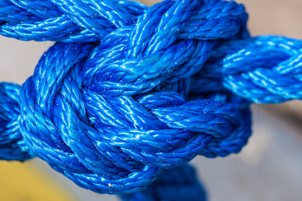 istock Blue sailing rope tied with knots 2174693630