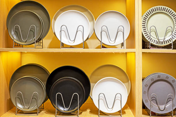 istock ceramic stylish plates on a yellow background in the interior 2174694943