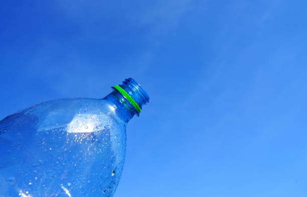 istock Plastic bottle on blue sky background. Plastic recycling and waste collection 2174697733