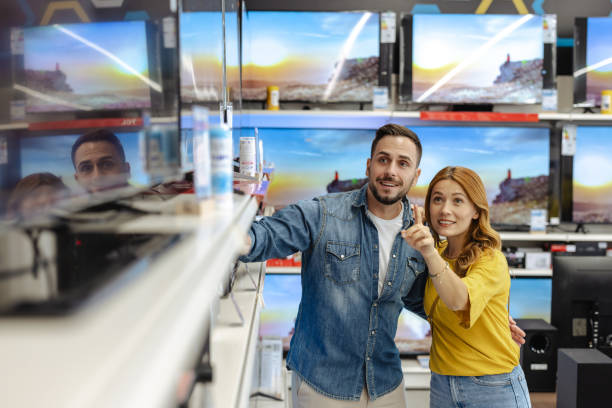 istock Couple shopping for new TV in an electronics store 2174699178