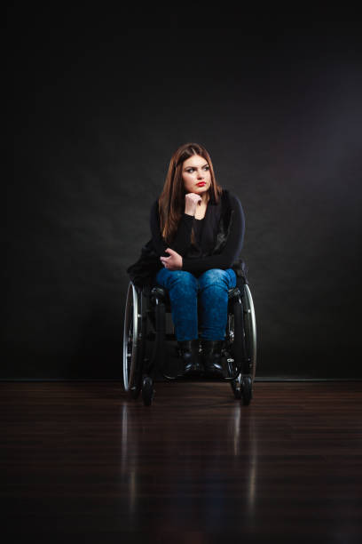 istock Sad girl on wheelchair. 2174699289