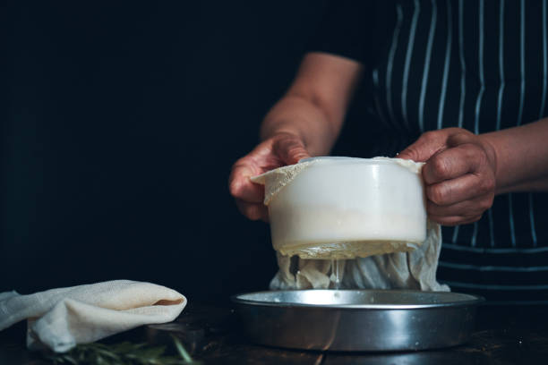 istock Making Fresh White Cheese in Domestic Kitchen 2174699843