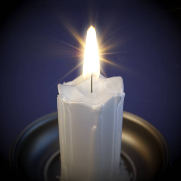 A single white candle burns steadily, casting a warm glow in a dimly lit room, creating an inviting and peaceful ambiance perfect for quiet moments.