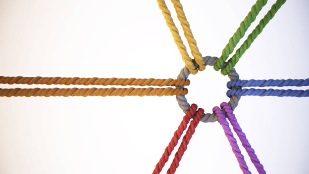 Multiple vibrant ropes converge at a central knot, showcasing a unity of colors and strength, representing teamwork and collaboration in a creative environment.