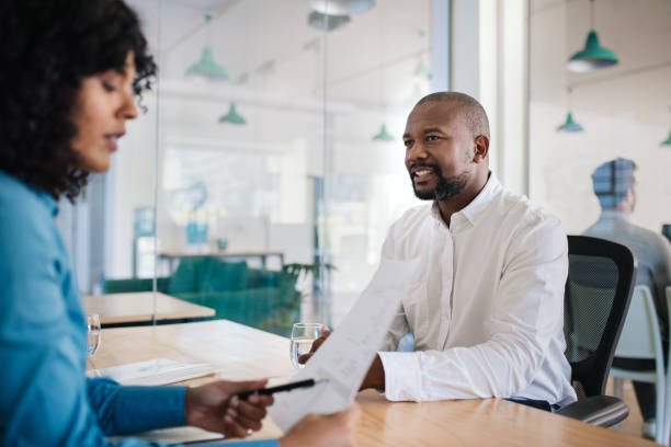 istock Job applicant smiling during an interview in an office 2174702249