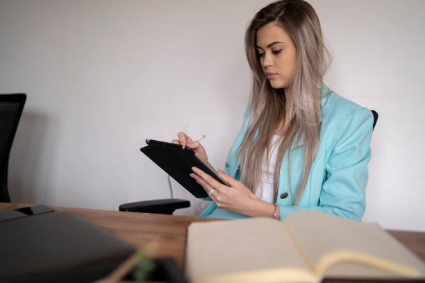 istock Beautiful business woman working with laptop 2174703122