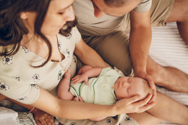 istock Sleeping baby in mom's arm 2174703419