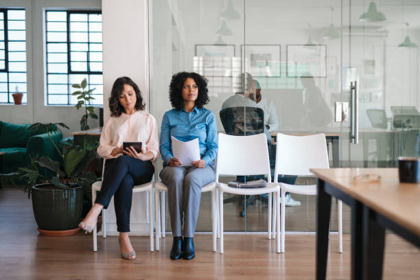 istock Two job applicants waiting in an office for their interviews 2174703713