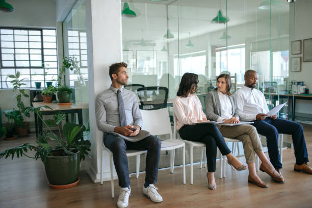 istock People sitting together in an office waiting for interviews 2174704837