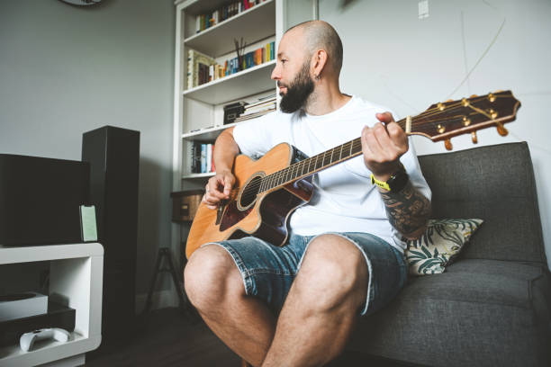 istock man plays the guitar and sings songs 2174705836