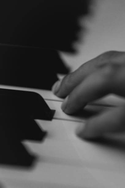 istock Piano keys person plays classical music black and white 2174710080