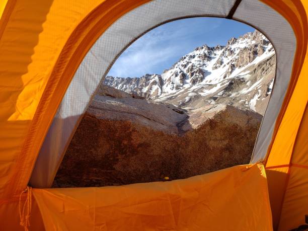 istock Snow mountains view from a tent window at a savage camping in Andes. 2174710968