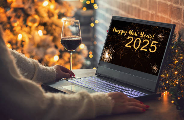 istock Woman enjoying at home while using laptop in a cozy Christmas atmosphere 2174712838