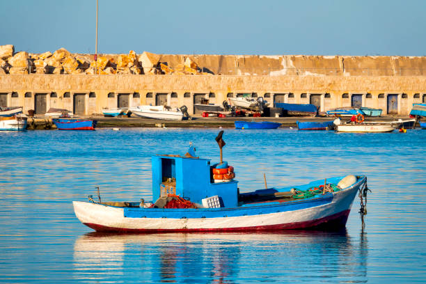 A traditional gozzo boat moored at Molo Sant'Antonio, Bari, Italy.
