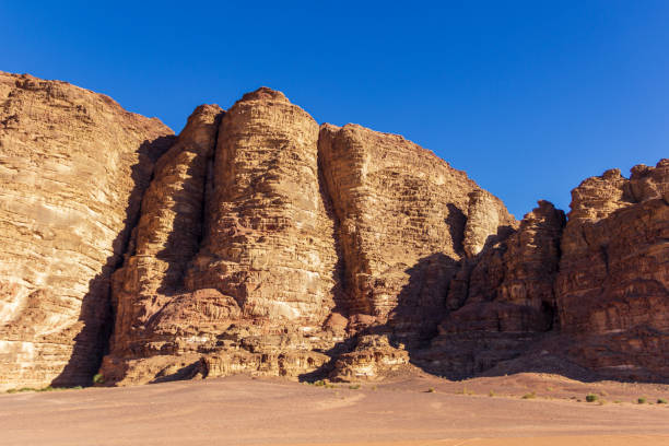 istock Sand Dunes and Rugged Rock Formations in the Jordanian Desert 2174716446