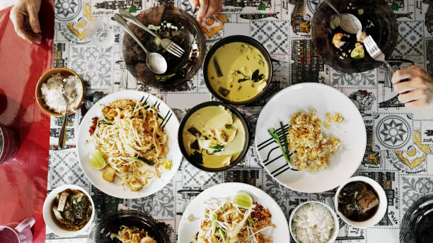 High angle view of a variety of traditional Thai dishes arranged on a table