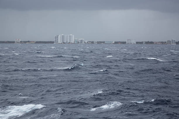 Rough seas during a storm create angry ocean and breaking waves.