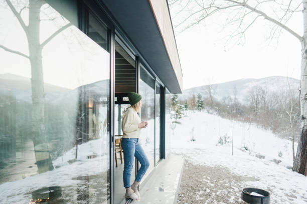 istock Spending a winter day in the cabin house 2174725007