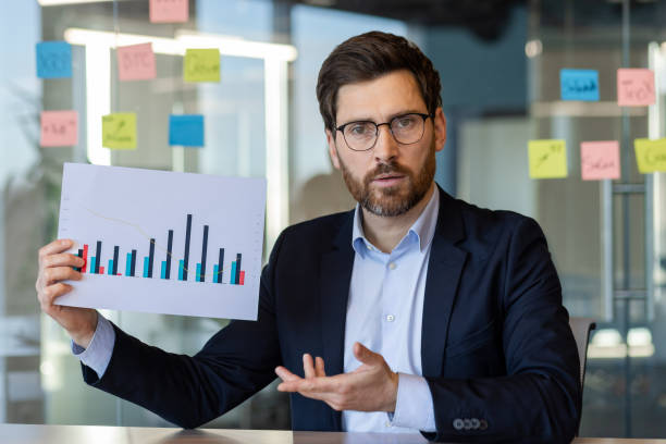 istock Businessman presenting financial chart in office meeting discussion 2174738495