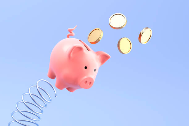 istock Piggy bank jumping on metal spring 2174741172