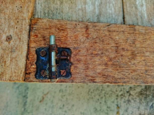 istock Rustic Wooden Door Hinge on Weathered Wood Surface 2174744548