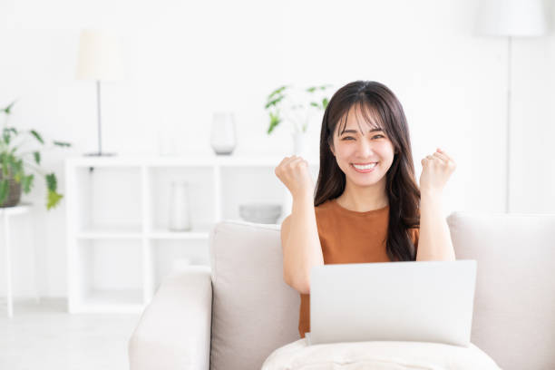 istock young asian woman using laptop 2174745877