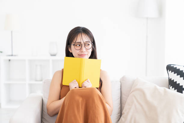 istock attractive asian woman who reads a book, 2174745894