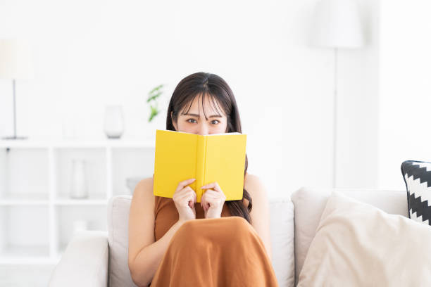 istock attractive asian woman who reads a book, 2174745972