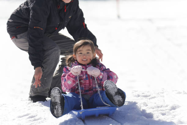 istock Parents and children playing on a sled 2174751451