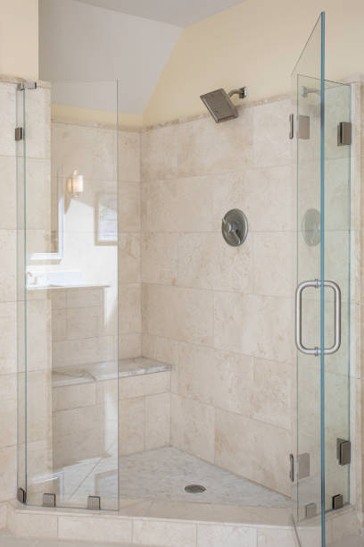 istock Glass Shower Enclosure With Tiled Walls And Showerhead 2174751946