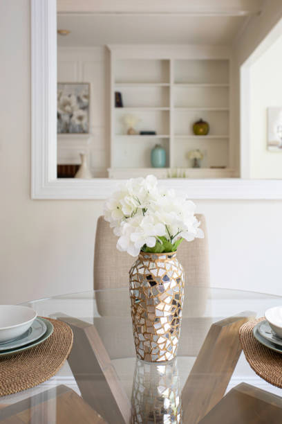 istock Dining Table With Decorative Floral Vase Centerpiece. 2174751961
