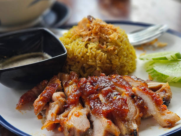 istock Thai southern style grilled chicken serving with biryani rice 2174754486