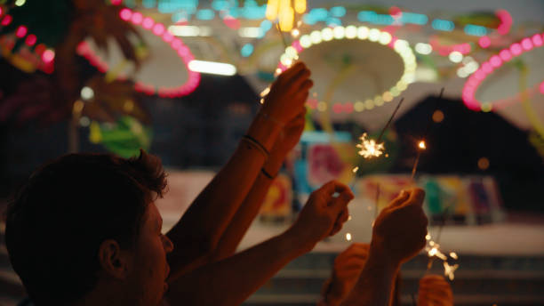 istock Joyful Evening with Sparklers at Theme Park 2174755791