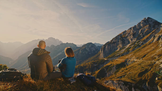 istock Caucasian Hikers Enjoy Mountain Vista During Break 2174757685