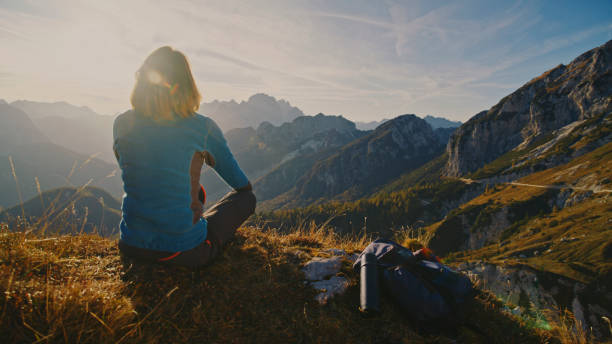istock Caucasian Female Hiker Admires Mountain Panorama 2174757708